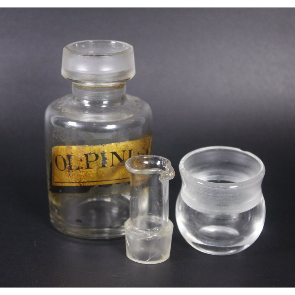 Antique apothecary bottle with cup lid ol pini sylv, rheumatism cure medicine